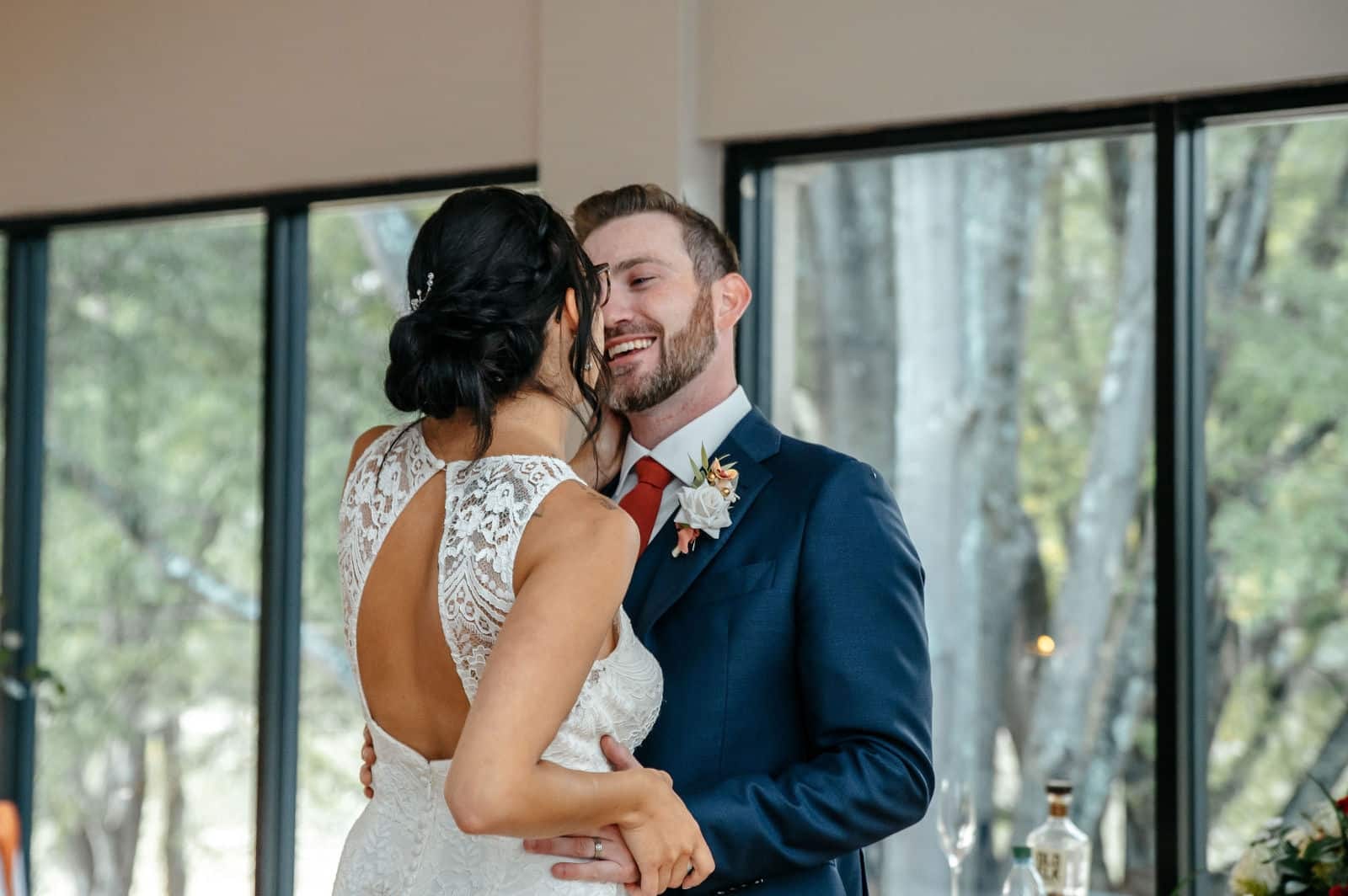 Bride and groom sharing a sweet moment during their reception photographed by a Georgia wedding photographer.