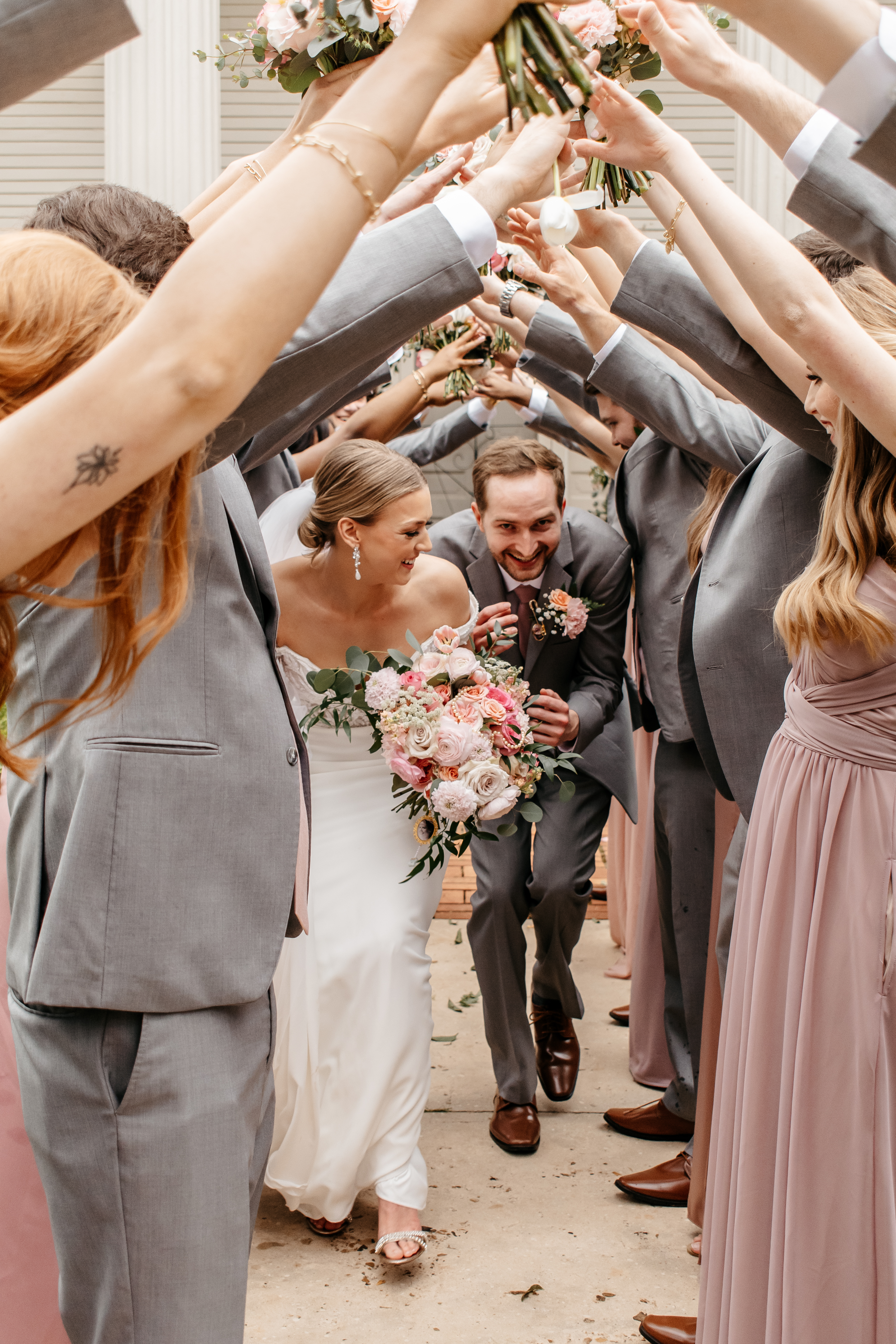 Bride and groom celebrating with their wedding party at a best wedding venue in Georgia.