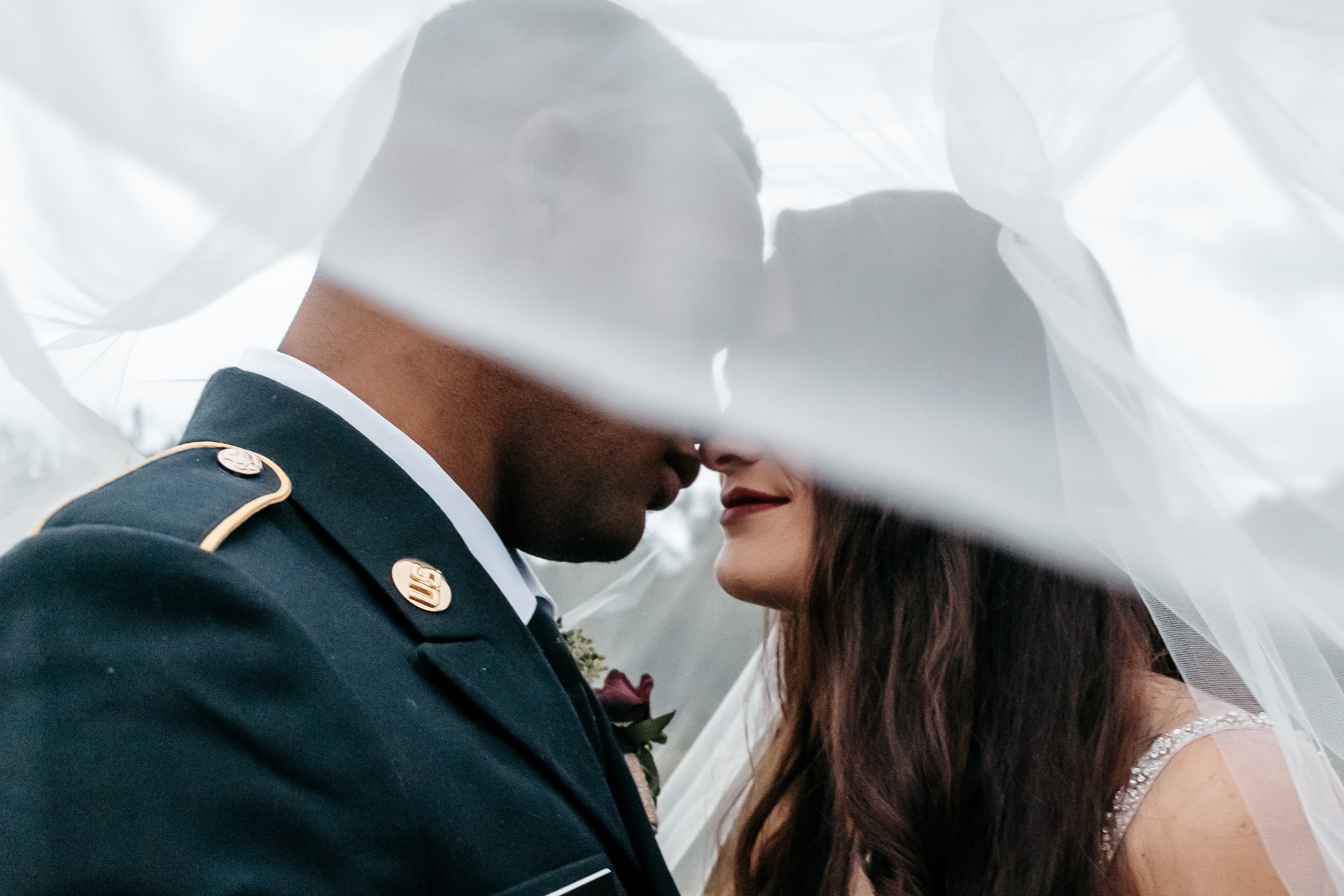 Bride and groom sharing an intimate moment outdoors at one of the best Georgia wedding venues.