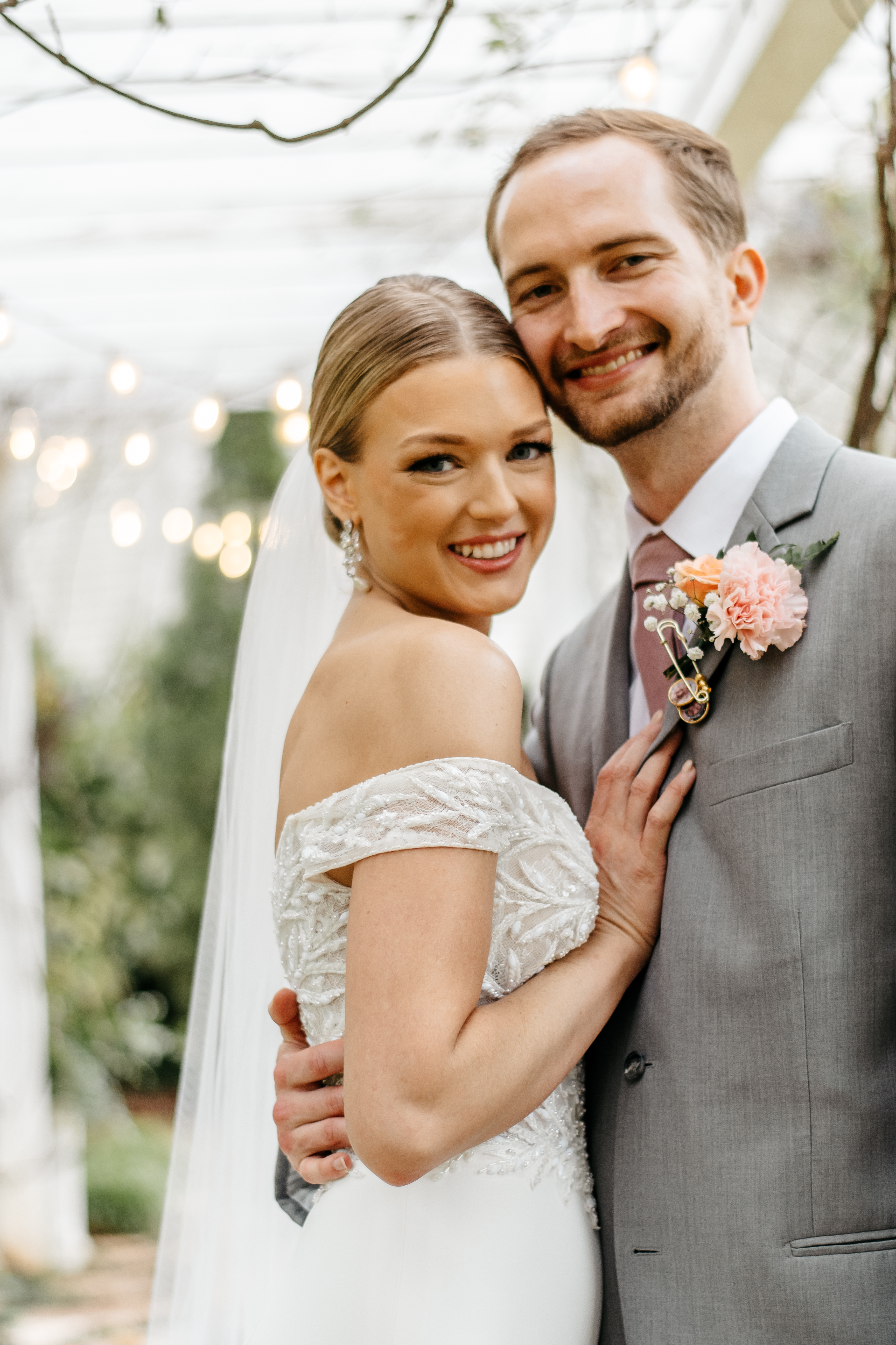 Bride holding a white wedding bouquet at one of the best wedding venues in Georgia.