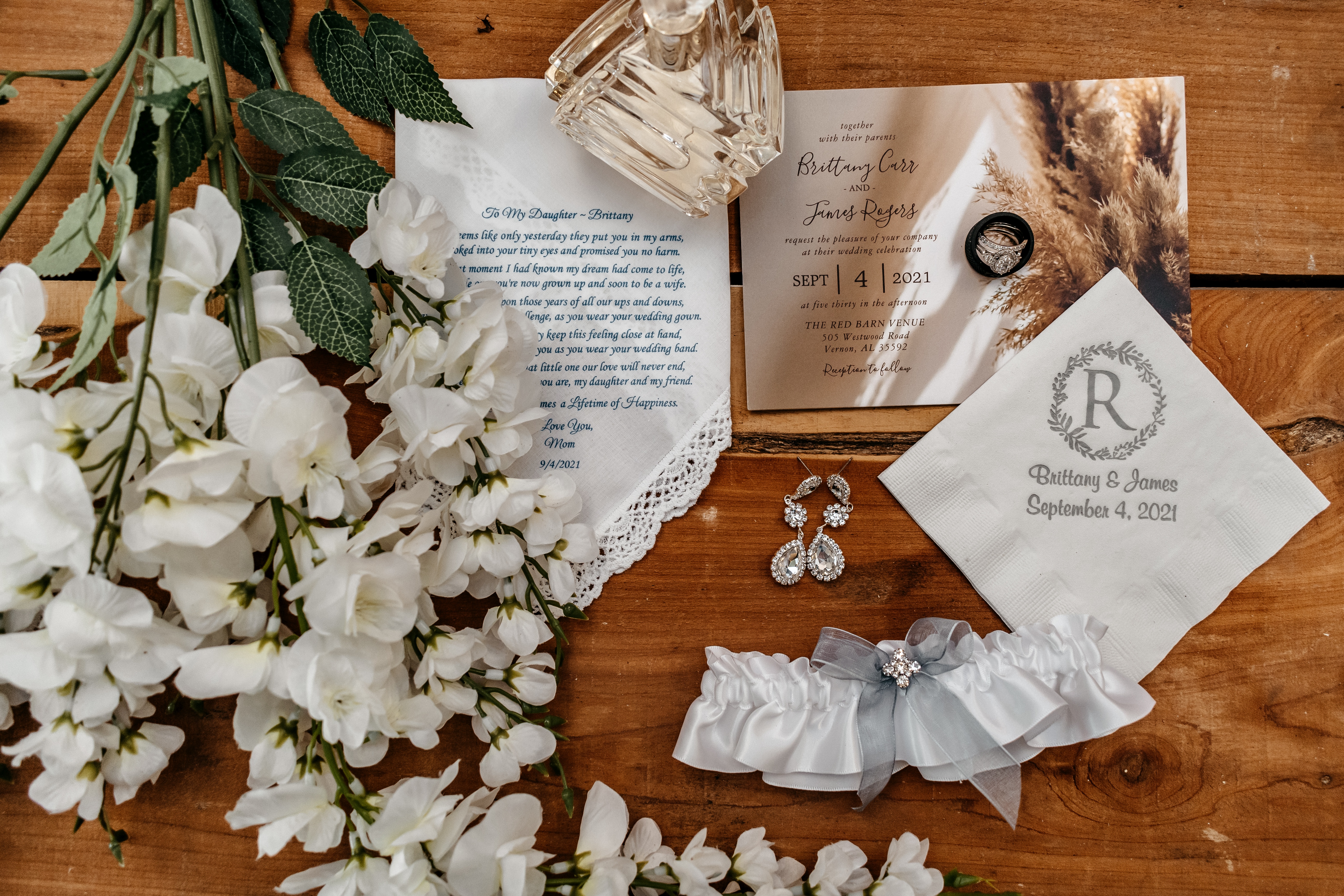 Wedding invitation suite, rings, and bridal details at one of the best wedding venues in Georgia.